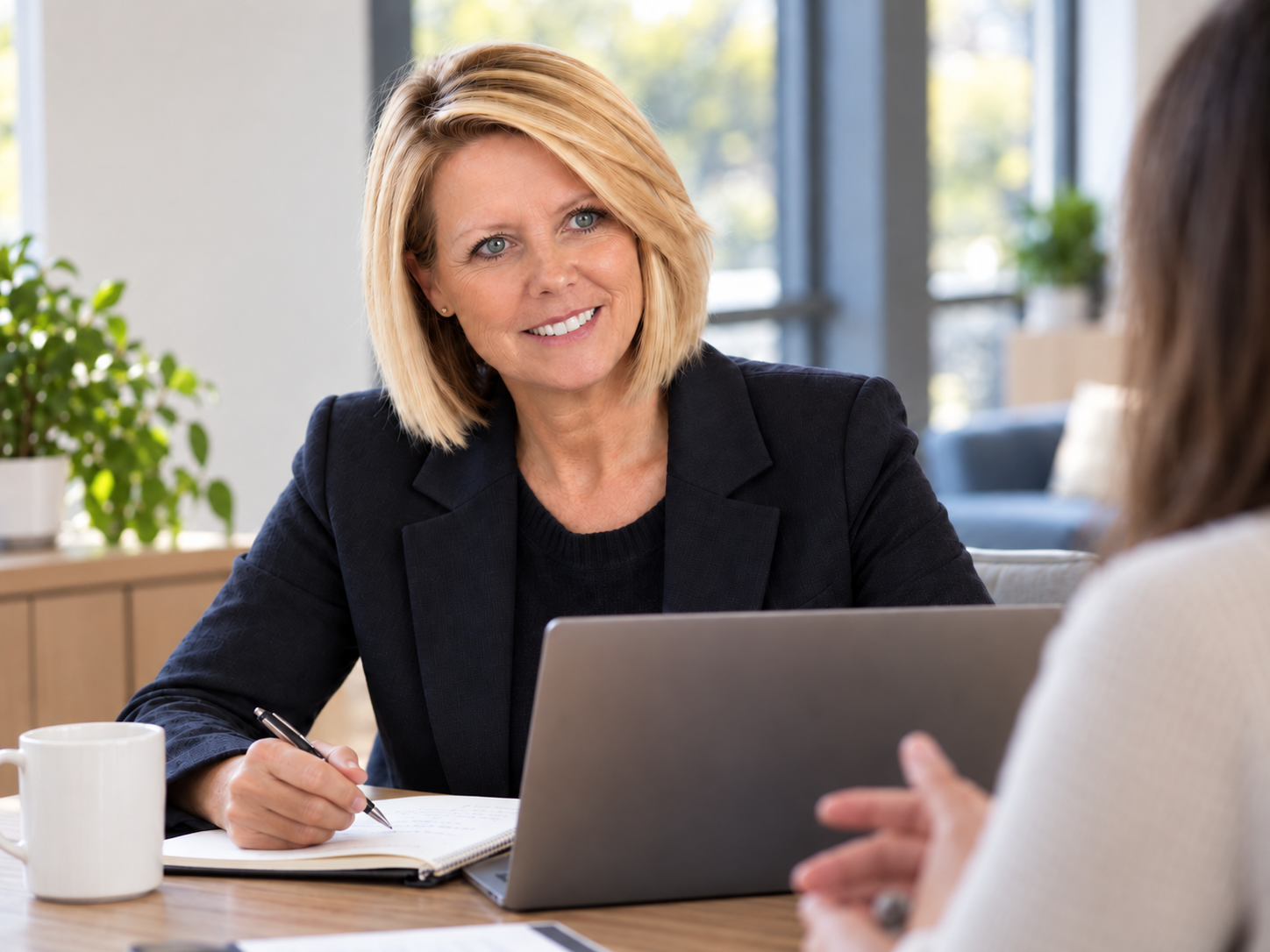 Tammy Kelly in a working conversation with a client